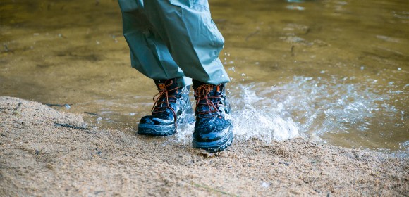 Outdoor boots in a puddle